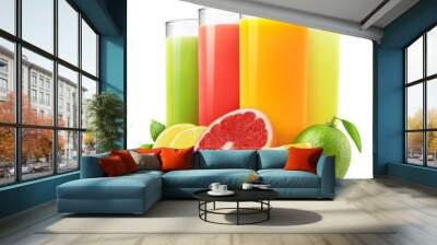 Isolated drinks. Glasses of fresh citrus juices (orange, grapefruit, lemon, lime) and cut fruits isolated on white background Wall mural