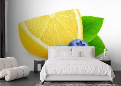 Isolated fruits. Slice of lemon and two blueberries isolated on white background with clipping path Wall mural