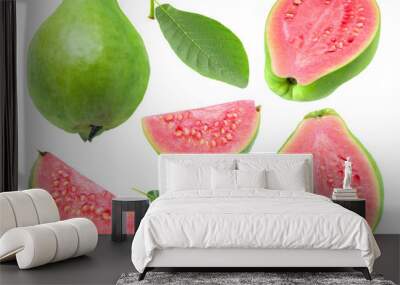 Isolated guava. Collection of green pink fleshed guava fruit pieces and leaves isolated on white background with clipping path Wall mural