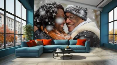 A couple shares a heartwarming moment in the snowy wonderland, their smiles and winter attire capturing the joy of love and the magic of the season Wall mural