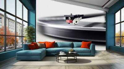 A dynamic close-up image showcasing the turntable needle as it glides over a spinning vinyl record, highlighting motion and the classic appeal of vinyl music playback in modern times. Wall mural