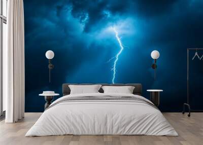 A striking singular lightning bolt cutting through the deep blue and dark storm clouds, highlighting the immense power and beauty of a natural atmospheric phenomenon. Wall mural