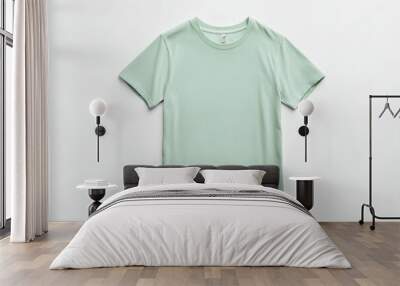 This image shows a plain mint green t-shirt on a white background. The angle and lighting highlight the shirt's material and structure, presenting an everyday fashion item. Wall mural