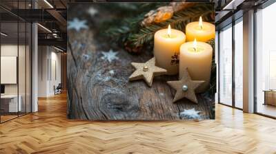 Three gold candles burn warmly, accompanied by glittering gold stars, set against a rustic wooden table, creating a charming holiday decoration scene. Wall mural