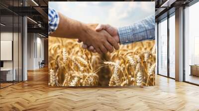 two farmers seal their partnership in a golden wheat field, their hands embodying the hard work and  Wall mural