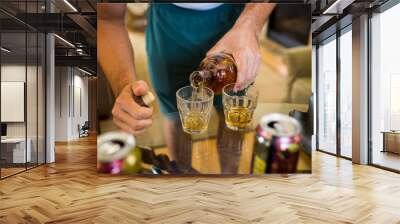 Pouring whiskey closeup shorts t-shirt 2 glasses Wall mural