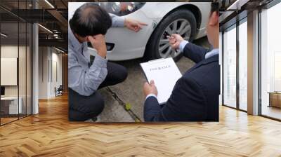 Loss Adjuster Insurance Agent Inspecting Damaged Car. Wall mural