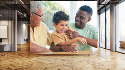 Black family grandfather, child and father playing, having fun and enjoy time together in Angola home. Bonding, love and happy African generation of kid son, grandpa and dad tickling laughing boy Wall mural