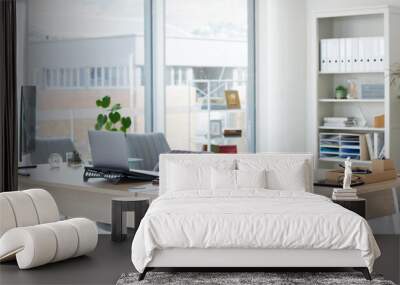 Clean, bright and empty home office interior organized with a computer and desk inside. Modern, contemporary and work space view of a decorated room with stylish decor and wooden furniture indoors Wall mural