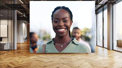 Portrait, outdoor and black woman with business, smile and career with agency, company and startup. Face, African person and employee in a city, team and blurry background with consultant and agent Wall mural