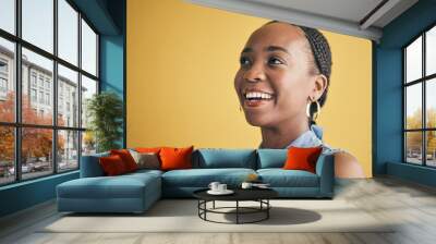 Thinking, smile and black woman in creative business studio isolated on a yellow background mockup space. Vision, happy and African designer, entrepreneur and employee worker planning startup idea. Wall mural