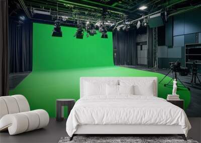 A green room with a green screen and a camera Wall mural