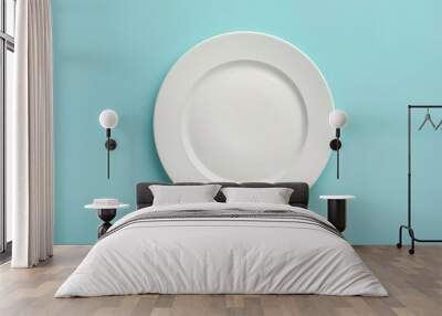 Empty white plate on gray background with teal wall Wall mural