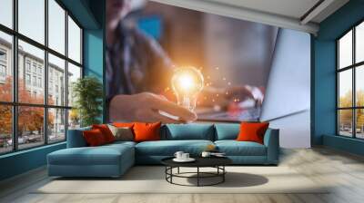 Business man holding light bulbs, ideas of new ideas with innovative technology and creativity,New ideas with innovation and creativity concept, Wall mural