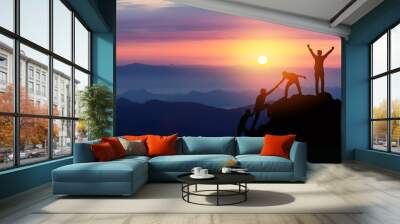 Teamwork friendship hiking help each other trust assistance silhouette in mountains, sunrise. Teamwork of two men hiker helping each other on top of mountain climbing team beautiful sunrise landscape Wall mural