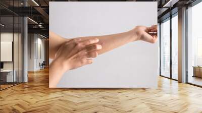 A girl scratch the itch with hand because of mosquito bites isolated on white background, Concept with healthcare and medicine. Wall mural