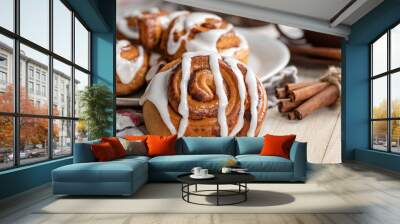 Baked Cinnamon Roll With White Icing Wall mural