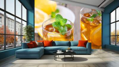 Glass of Refreshing Ice Tea With Lemon Slices and Mint Leaves Wall mural