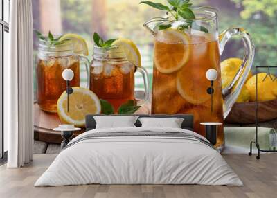 pitcher of cold ice tea with rural summer background Wall mural