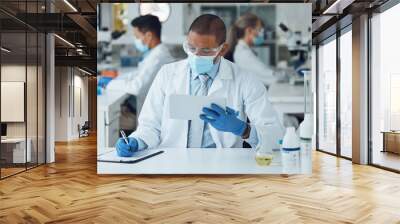 Face mask man, tablet or writing in science laboratory for medical virus research, medicine or vaccine development. African scientist, technology or clipboard paper for healthcare and disease control Wall mural