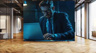 A focused FBI agent using a laptop to process data and intercept communications related Wall mural