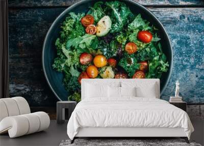 Overhead view of a fresh salad with a variety of vegetables such as spinach, kale, and cherry Wall mural