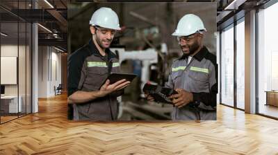 Two Industry engineers stand and discussion work in the factory workshop. Wall mural