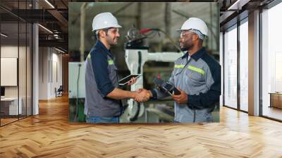 Two Industry engineers stand and discussion work in the factory workshop. Wall mural