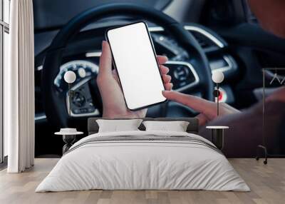 hand man holding use smartphone new model, For searching for directions, travel, in the latest car models.Concept of using a car phone For convenience and reduce accidents.blank screen Wall mural