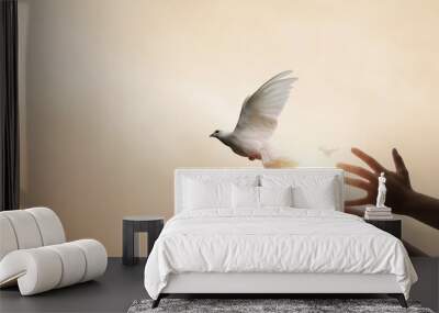 Praying hands and white dove flying happily on blurred background with sunset , hope and freedom  concept. Wall mural