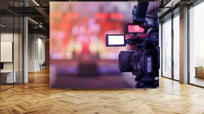 professional video camera with stream at a concert, live broadcast of the press conference stream to the Internet. Wall mural