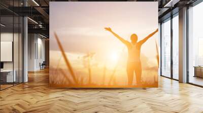 Young woman raise hands up for her success, Concept of Success i Wall mural