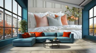 A neatly made bed with white linens and decorative pillows in a modern bedroom. Wall mural