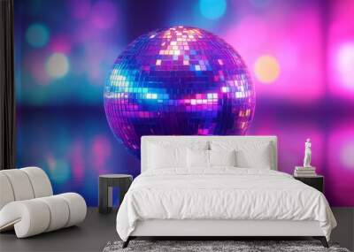 A vibrant disco ball reflecting colorful lights in a lively setting. Wall mural