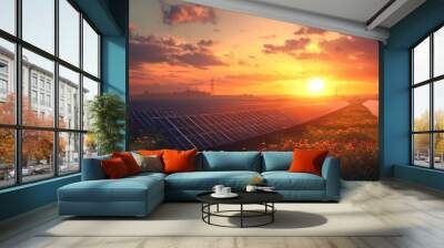 Solar panels in a vibrant sunset landscape with blooming flowers. Wall mural