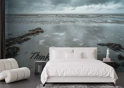 The words 'Think Positive' are written in the sand on a beach with a stormy sky above. Wall mural