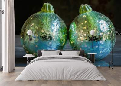 Two green and blue disco ball pumpkins on a table. Wall mural