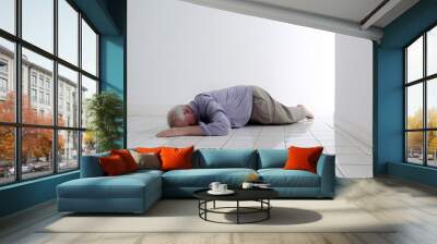 An old man accidentally slipped and fell face down and passed out in a bathroom with slippery floor tiles. Copy space. Wall mural