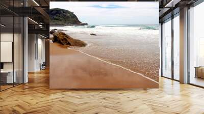 Beach on a cloudy day Wall mural