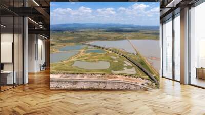 Aerial Unseen view of railroad tracks of floating Train bridge with white car in Khok Salung, Pa Sak Jolasid dam Lopburi amazing Thailand, Known as a floating train route. Wall mural