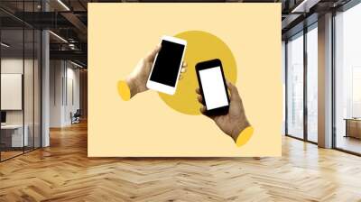 Two hands holding mobile phones with black screen isolated on yellow background. Art collage digital pop modern art. Wall mural