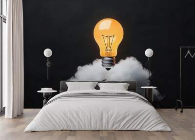 A glowing light bulb emerging from a cloud, symbolizing creativity and inspiration against a dark background. Wall mural