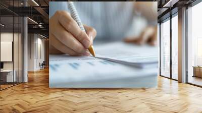 Close-up of a person reviewing debt documents at a desk, debt analysis, financial management, budgeting Wall mural