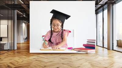 Asian cute girl with book on the desk white background back to school concept Wall mural