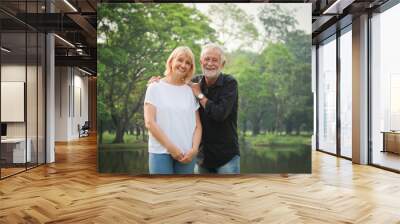 Portrait of Senior couple retirement Man and woman happy in park together Wall mural