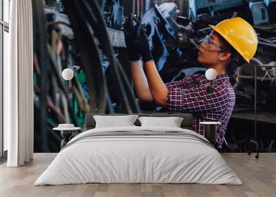 Young Asian Engineer woman  working with machine in factory. Wall mural