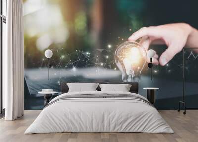 for Concept new idea, concept with innovation and inspiration, innovative technology in science concept and modern business development,creative idea,man pointing light bulb on table Wall mural