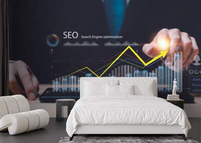 Marketer showing SEO concept,optimization analysis tools, search engine rankings, social media sites based on results analysis data,Website Search Optimization ,Interesting web rankings from visitors Wall mural