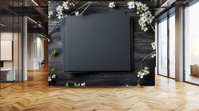 dark gray blank card mockups, laying on top of each other with white flowers and branches in the background, on a dark wooden table Wall mural