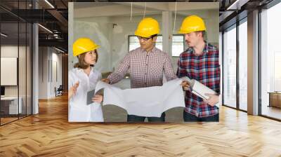 Engineer group and worker meeting, discussion with construction blueprint on site work Wall mural